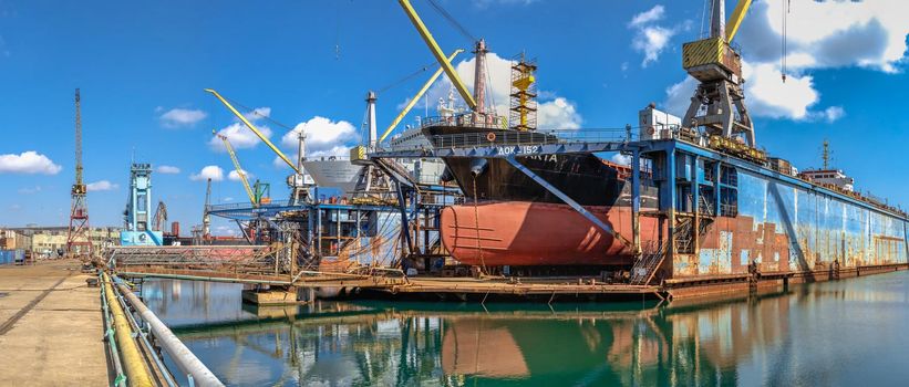 Chernomorsk, Ukraine. 21.03.2021. Large ship in dry dock of the Chernomorsk Shipyard on a sunny spring day