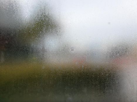 Water drops steam of rain on window glass after the rain