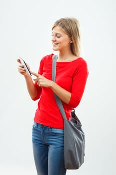 Portrait of female student using digital tablet.