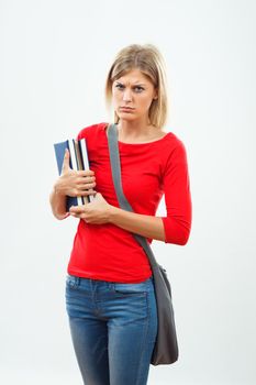Image of angry  female student holding books.