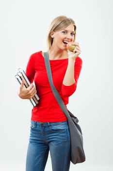 Image of female student eating apple.