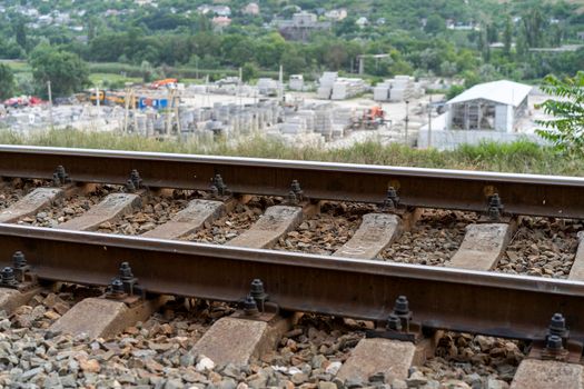 Industrial landscape with a view of the railway tracks.