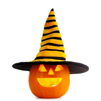 Jack O Lantern Halloween funny pumpkin with carved smiling face with witches hat isolated on white background