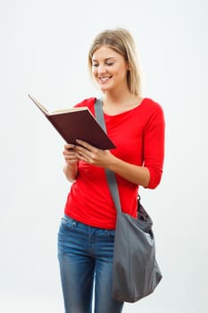 Image of female student reading a book.