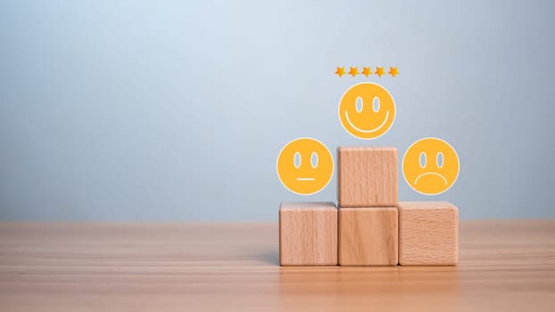 Human resources concept for leaders and team leaders. Business concept. Wooden blocks line up with smiling face icons.