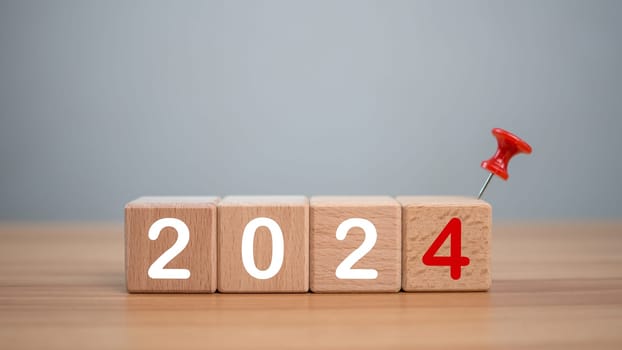 Wooden blocks lined up with the letters 2024. Represents the goal setting for 2024, the concept of a start. financial planning development strategy business goal setting