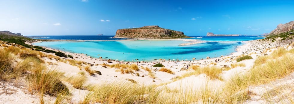 Crete Greece, Balos lagoon on Crete island, Greece. Tourists relax at the crystal clear ocean of Balos Beach. Greece