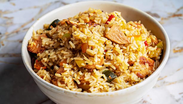 Chicken biryani Spicy Indian Malabar biryani Hyderabadi biryani, Dum Biriyani pulao golden bowl Kerala India Sri Lanka Pakistan basmati rice mixed rice dish with meat curry Ramadan Kareem, Eid