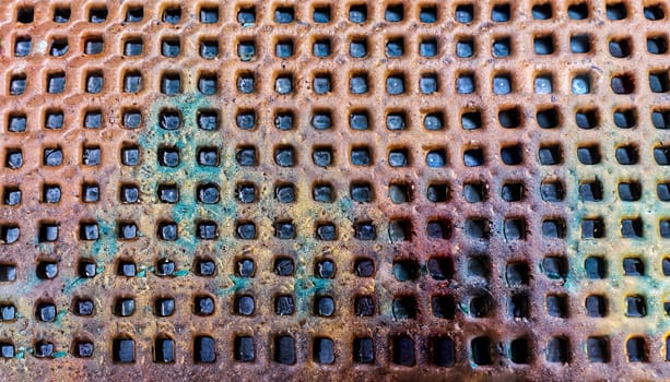 rusty metal grilles of an old sewer for water drainage. photo close-up, top view