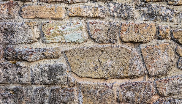 Texture of a stone wall. Old castle stone wall texture background. Stone wall as a background or texture. Part of a stone wall, for background or texture