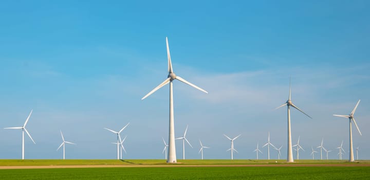 Windmill park with clouds and a blue sky, windmill park in the ocean aerial view with wind turbine Flevoland Netherlands Ijsselmeer. Green Energy production in the Netherlands