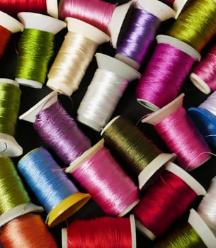 close-up colorful threads,craft threads,colorful lace knitting threads wound on spools,