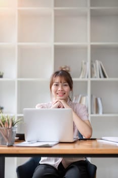 Portrait of accountant woman working on financial strategy as growth at startup company with smile..