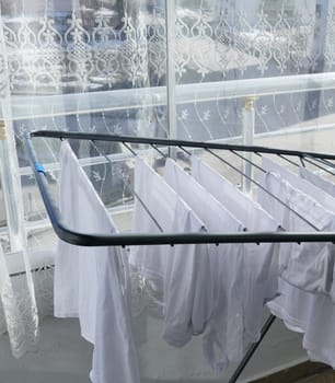 Drying clothes on the balcony in sunless and cold weather,