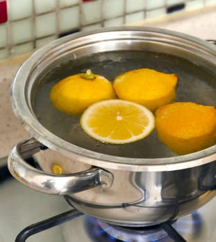 boiling lemons in a pot for a cold,