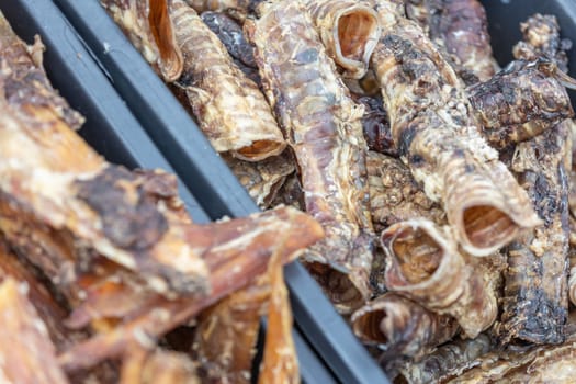 Close up of dried meat for the dog, snack for doggy, animal food concept