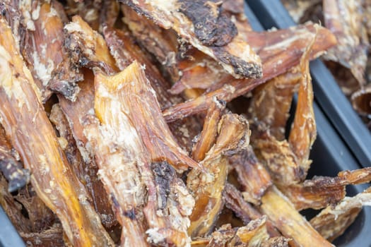 Close up of dried meat for the dog, snack for doggy, animal food concept