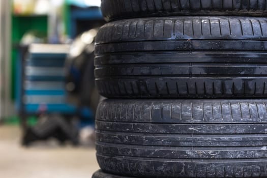 Set of summer tires of the car in a car service, transport concept