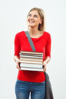 Portrait of happy female student holding books.