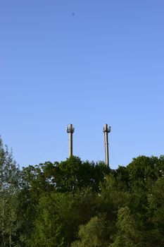 Cellular antennas at the top of the chimney. Telecommunications tower. Receiver-transmitter of the signal. Cellular aerials repeater.