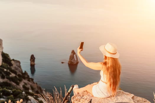 Selfie woman in cap and tank top making selfie shot mobile phone post photo social network outdoors on sea background beach people vacation lifestyle travel concept