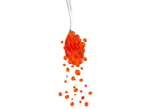 red fish caviar in a spoon and eggs falling down, isolated on white, red, cuisine, delicacy
