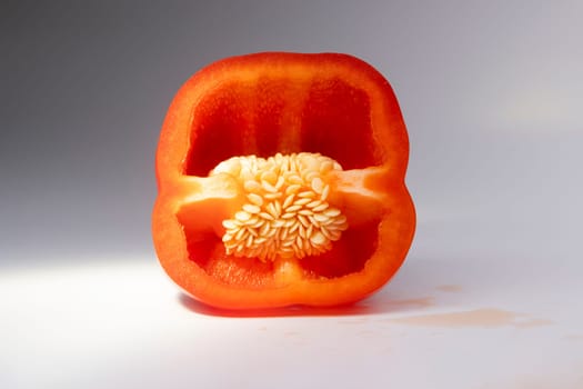red sweet pepper seeds in the middle on a white background,red, cuisine, delicacy