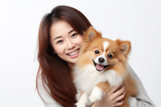 young asian adult woman holding her dog on white background, AI Generated