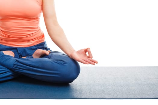Close up of of woman in yoga asana Padmasana (Lotus pose) cross legged position for meditation with Chin Mudra - psychic gesture of consciousness. Isolated on white background with copyspace