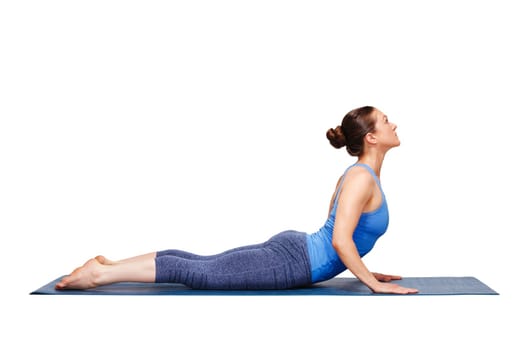 Beautiful sporty fit yogini woman practices yoga asana bhujangasana - cobra pose in studio isolated on white