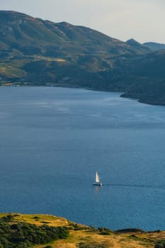 Yacht boat in Aegean sea near Milos island on sunset. Milos island, Greece