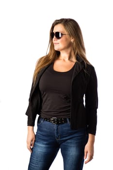 Forty year old woman, wearing sunglasses and a sport jacket, isolated on a white background