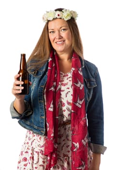 Forty year old woman, wearing bohemian style clothing and a flower crown, having a beer, isolated on a white background