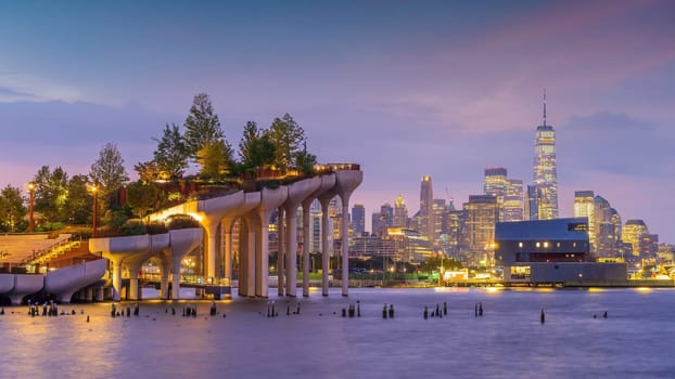 Cityscape of downtown Manhattan skyline with the Little Island Public Park in New York City at sunrise