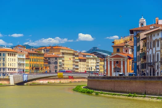 View of the medieval town of Pisa and river Arno in Italy