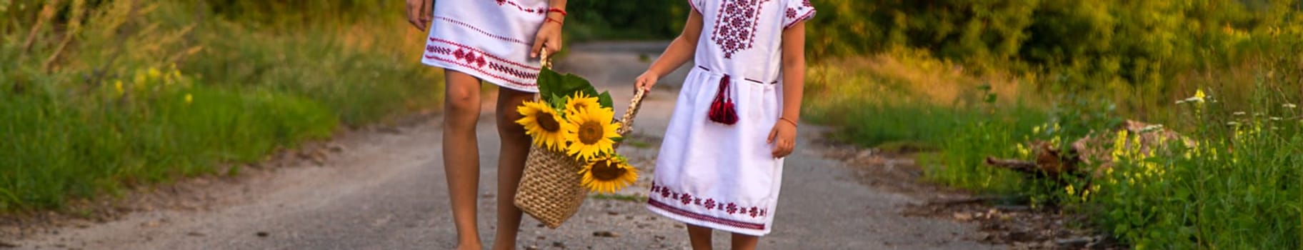 A child in a field of sunflowers Ukraine. Selective focus. Nature.