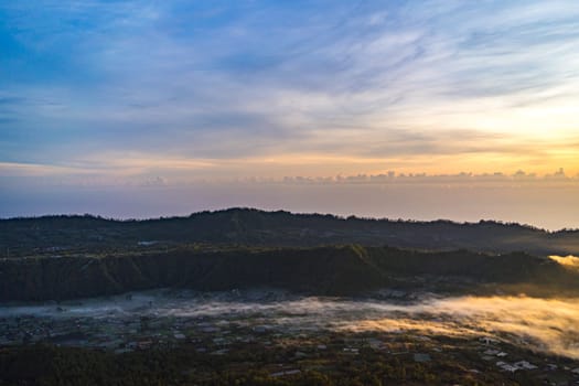 Amazing panorama view of village at the mount Batur. Rural Pinggan pano view with volcano Batur