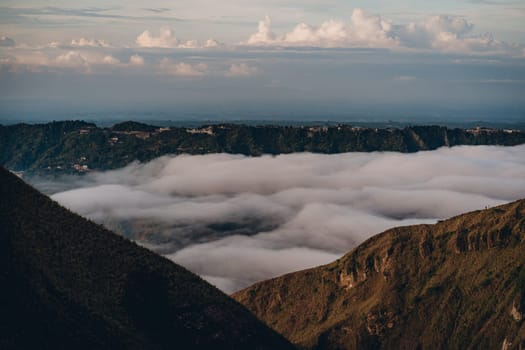 Landscape view of morning clouds and mist at mountain Batur. Sunrise trekking mount volcano Batur