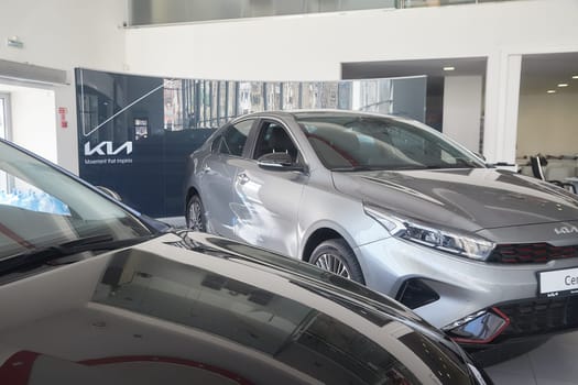 Kirov, Russia - April 12, 2022: Cars in showroom of dealership Kia in Kazan in Russia. Partial focus
