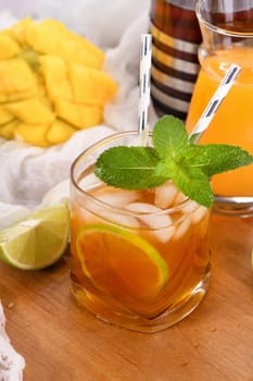 Mango iced tea with lime and mint has the perfect ratio of juice, tea and mint, sweetened with honey and so fresh and delicious. Prepare this summer refreshing organic soft drink.