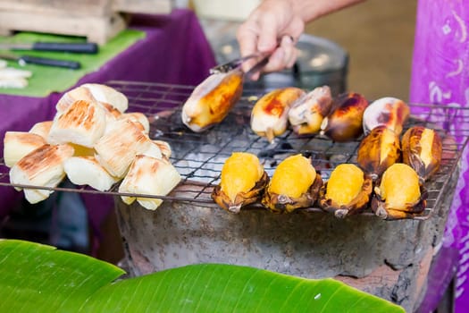 cassava and roasted banana on the grille for sale in market