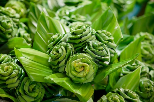 Pandan leaves are folded into a flower shape.