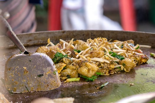 Oyster omelette in the panIs a kind of Chinese food consisting of flour, eggs and shellfish