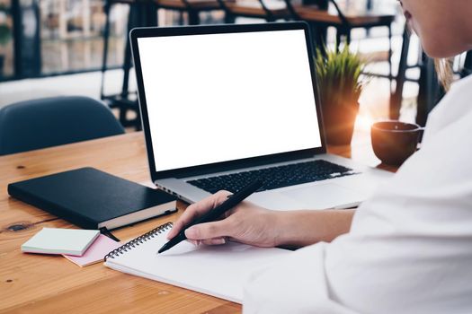 Close-up of a businesswoman using a laptop computer to audit the company's budget. Tax information is calculated by accountants