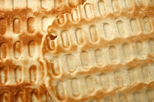 The surface texture of waffles, homemade cakes. Food backdrop.Waffles background.