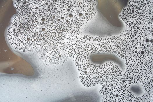 Abstract background white soapy foam texture. Shampoo foam with bubbles