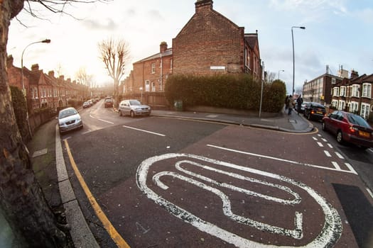 London, United Kingdom - February 17, 2007: Hawarden road in Walthamstow, ultra wide (fisheye) photo with number 20 (speed limit in residential area) on asphalt