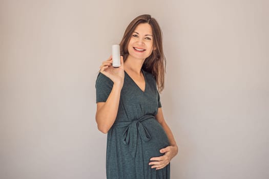 Confident and radiant pregnant woman over 40 showcasing the debate on pregnancy and deodorant. Is it good or bad for expectant mothers. Embrace the journey with safe and gentle options.