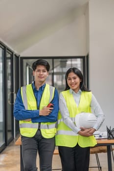 Portrait two engineer asian smileing building contractors standing at office.