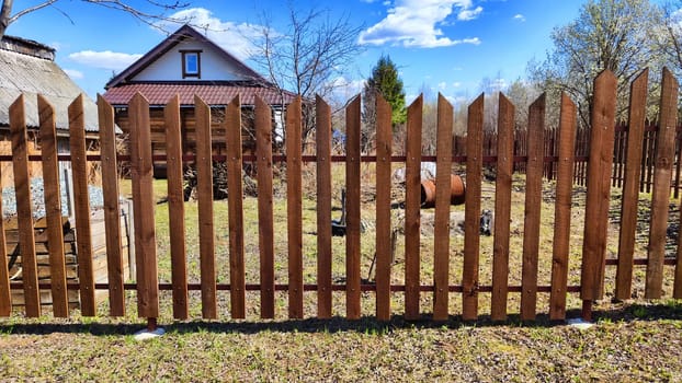 Old wooden planks in fence. Background and texture. Abstract frame and copy space. Ancient Wooden rustic rural fence